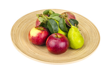 Ripe fruit on wooden plate