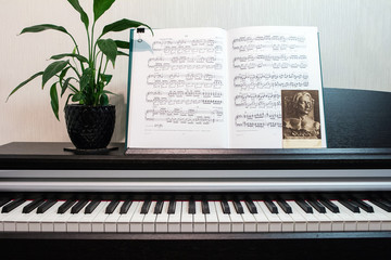 2018.09.18, Moscow, Russia. An open book of sheet music on the piano. A composition of the sheet...