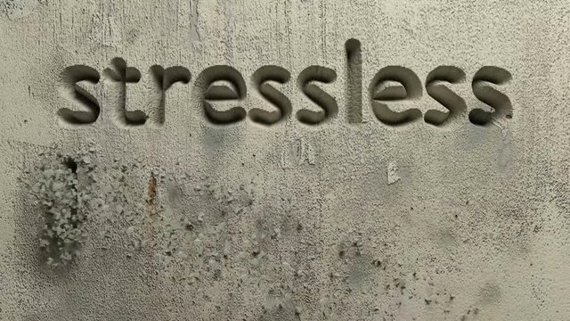 animation of stressless living word carved in a grey wall