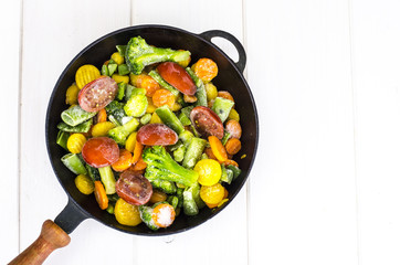Frying pan with frozen vegetables
