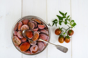 Red ripe frozen tomato