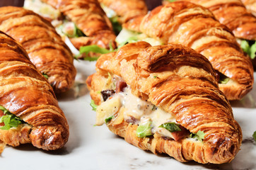 Chicken salad croissant sandwich on buffet table