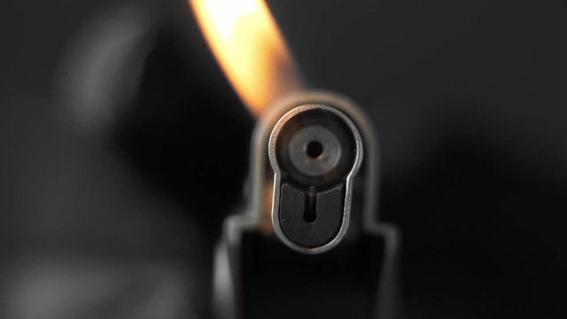 Chef uses a lighter. Gas Lighter with Flame. Fire.