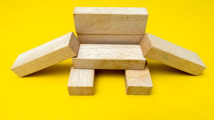 wood block on yellow background
