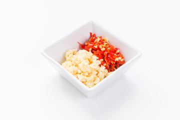 Chopped garlic and chilli in square bowl © teen00000