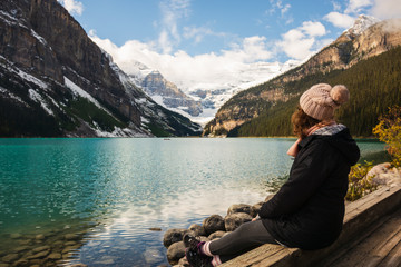 Woman enjoying the beautiful view at Lake Louise on a sunny day