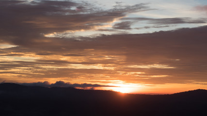 Fototapeta na wymiar Sunset with mountain Silhouette
