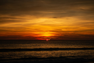 Fototapeta na wymiar Deep and Rich ORange Sunset at Karon Beach