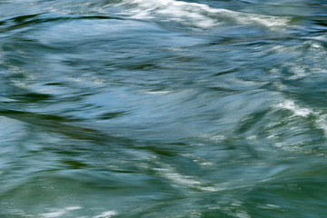 Flowing green river water