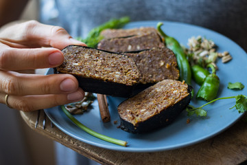 Raw vegan flax seeds bread bars with pumpkin and sunflower seeds in nori seaweed leaves. Vegan, vegetarian, healthy food