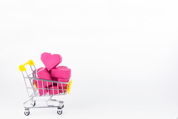 Shopping cart full of paper box red heart shape, isolated on white background with copy space.Concept Valentine's Day, Day of love.