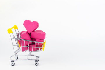 Shopping cart full of paper box red heart shape, isolated on white background with copy space.Concept Valentine's Day, Day of love.