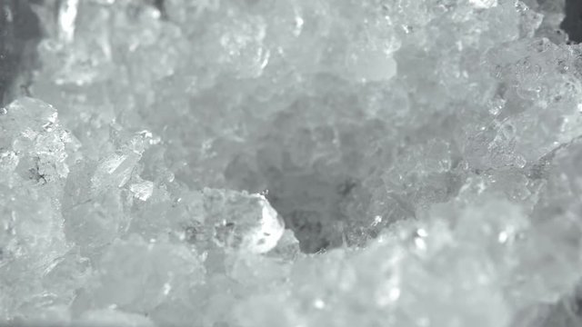 Close-up of a man with a shovel takes ice crush for a cocktail. Making of a cocktails. Negroni.