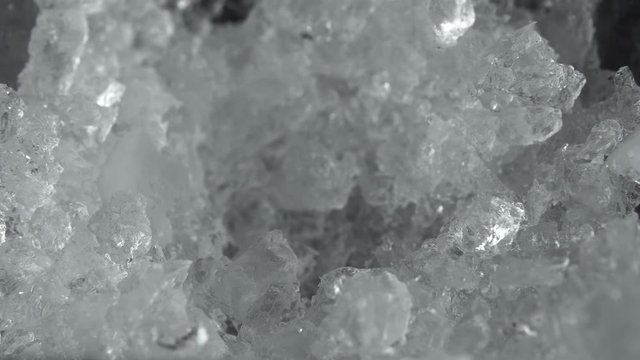 Close-up of a man with a shovel takes ice crush for a cocktail. Making of a cocktails. Negroni.