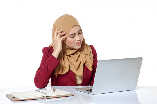 Portrait of pretty Asian hijap woman in front of laptop