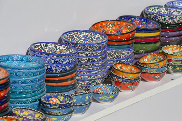 Selling colorful bowls in the shop of traditional Arabian market at Souq Waqif market in Doha, Qatar