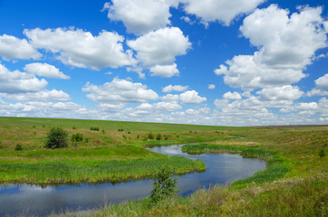 Fototapeta na wymiar Sunny summer landscape with river curve.Beautiful view of fields,meadows,pastures and woods.Tula region,Russia.