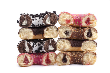 Broken donuts with different fillings on white background isolated