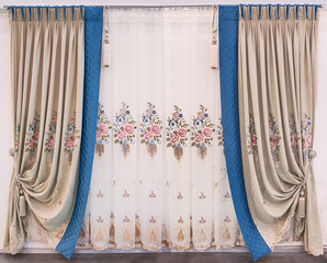 Modern interior design of the living room. Curtains made of natural fabrics of beige color with...