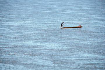 Fishing boats the banks of the Mekong River in Laos and Thailand