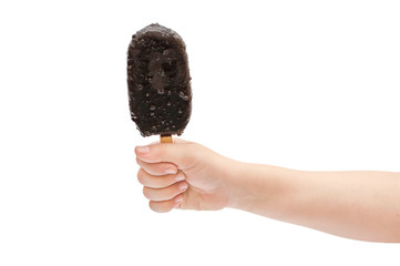 Child's hand holding ice cream on stick. Isolated on white.