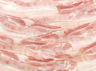 Slices of bacon as food background.