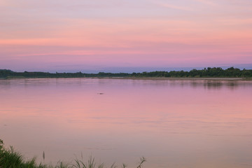 Fototapeta premium Atmosphere sunrise at the Mekong river is bordered by Thailand and Laos
