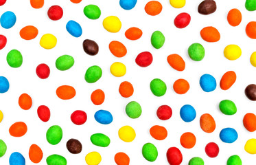 Background from colorful round candy on white.