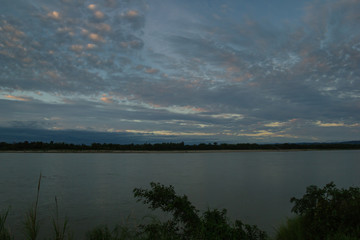 Atmosphere sunset at the Mekong river is bordered by Thailand and Laos