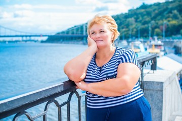 Size plus mature lady. Enjoying at day, concept human with  excess weight. Senior woman take a rest...