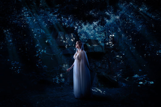 Elf girl in night forest