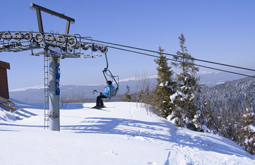 skiers on lift