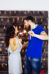 Marry Christmas and happy new year 2018. Couple celebrate with light