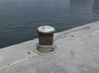 pier or jetty with a rope on a bollard in the harbor of Antwerp