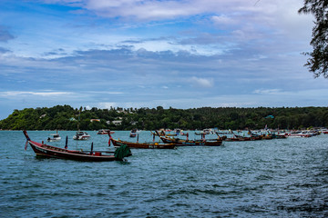 Long boats docked off the coast of Rawaii