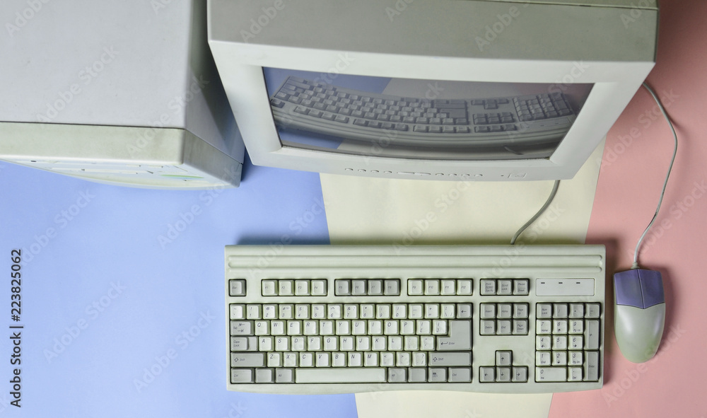 Poster retro stationary computer on colored background. monitor, system unit, computer mouse. obsolete tech