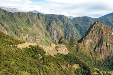 View of the Lost Incan City of Machu Picchu near Cusco, Peru. Machu Picchu is a Peruvian Historical Sanctuary and a UNESCO World Heritage Site. Machu Picchu is located in the Cusco Region in Peru.