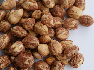 Fresh hazelnuts cores on a white background