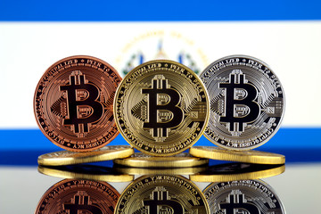 Physical version of Bitcoin (BTC) and El Salvador Flag. Conceptual image for investors in High Technology (Cryptocurrency, Blockchain Technology, Smart Contracts, ICO).