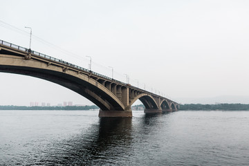 Fototapeta na wymiar Krasnoyarsk Central bridge over Yenisei river. Modern architecture. Krasnoyarsk region, Russia