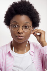good looking student in stylish shirt taking off earphones. close up portrait, clothes, fashion concept © alfa27