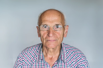 Elderly man with glasses