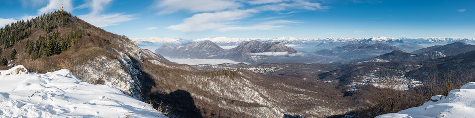 View from the Campo dei Fiori regional park, Varese, Italy. Below Brinzio and Valcuvia with Luino, Lake Maggiore. In the background, Alps from the Strahlhorn (4190 m) to the mountains of Lugano