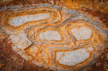 Natural background of petrified lava on the coast of the island. Madeira. Portugal