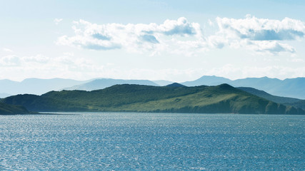 Seascape, hilly Peninsula on the horizon in the distance.