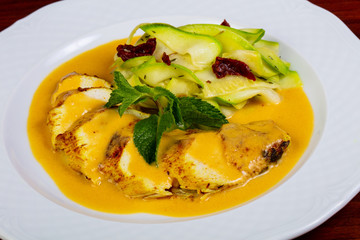 Chicken breast in orange sauce