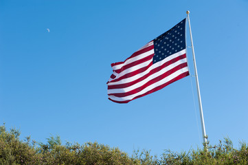 flag with moon rising day time