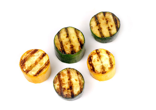 green and yellow zucchini on a grill
