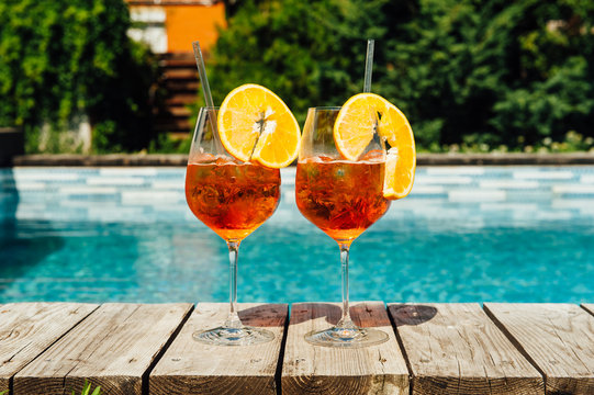 Two Glass of Aperol Spritz cocktail on the pool