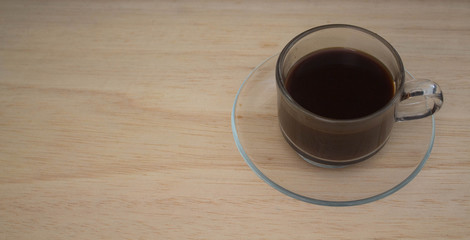 coffee cup on wooden background with Space for text.